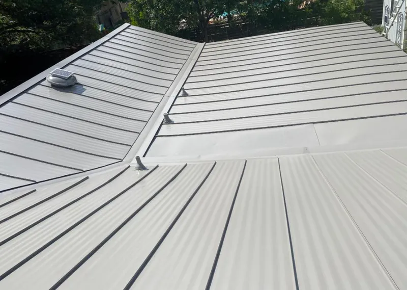 Solar attic fan installed on a metal roof for Roof Ventilation in Sunset Hills
